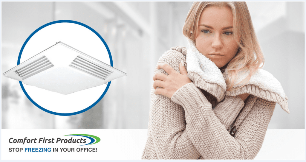 Woman feeling cold while holding herself with a blanket indoors.