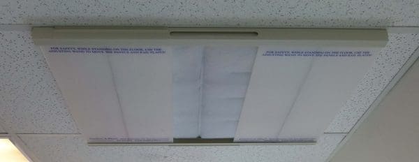 A whiteboard with handwritten text and a marker holder at the bottom.